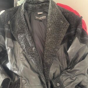 Y2K Wilson’s leather  one X trenchcoat with a fur trim around the collar and res